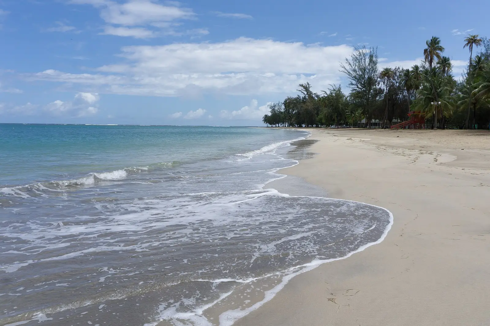 Palm-lined Luquillo Beach on Puerto Rico's northeast coast