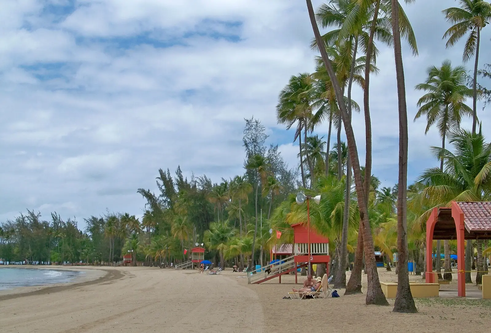 Palm-lined Luquillo Beach and calm blue water in Puerto Rico